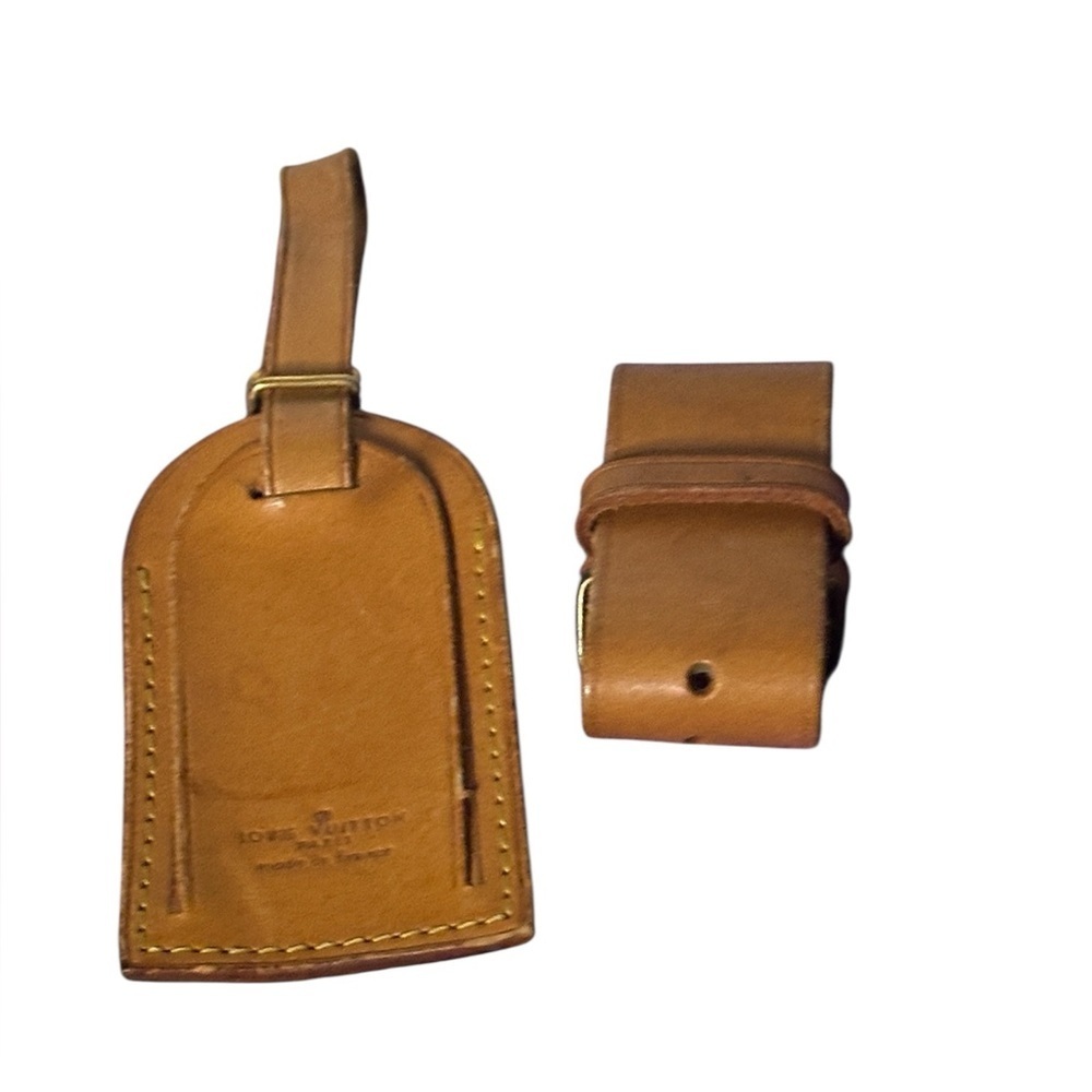 Louis Vuitton Vachetta leather luggage tag and a poignet handle keeper set.